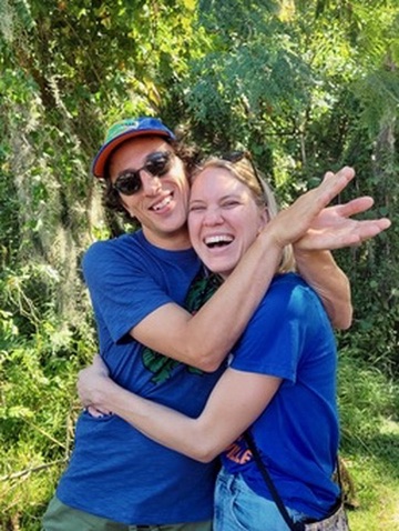 Blake and Josh hugging in the woods